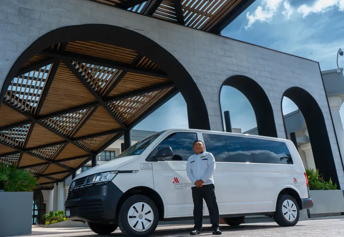 Prestige driver next to a Volkswagen Transporter