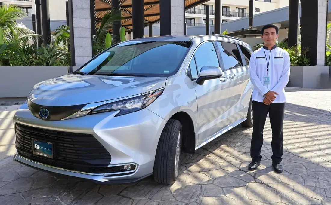 Prestige chauffeur next to a Toyota Sienna XLE Hybrid